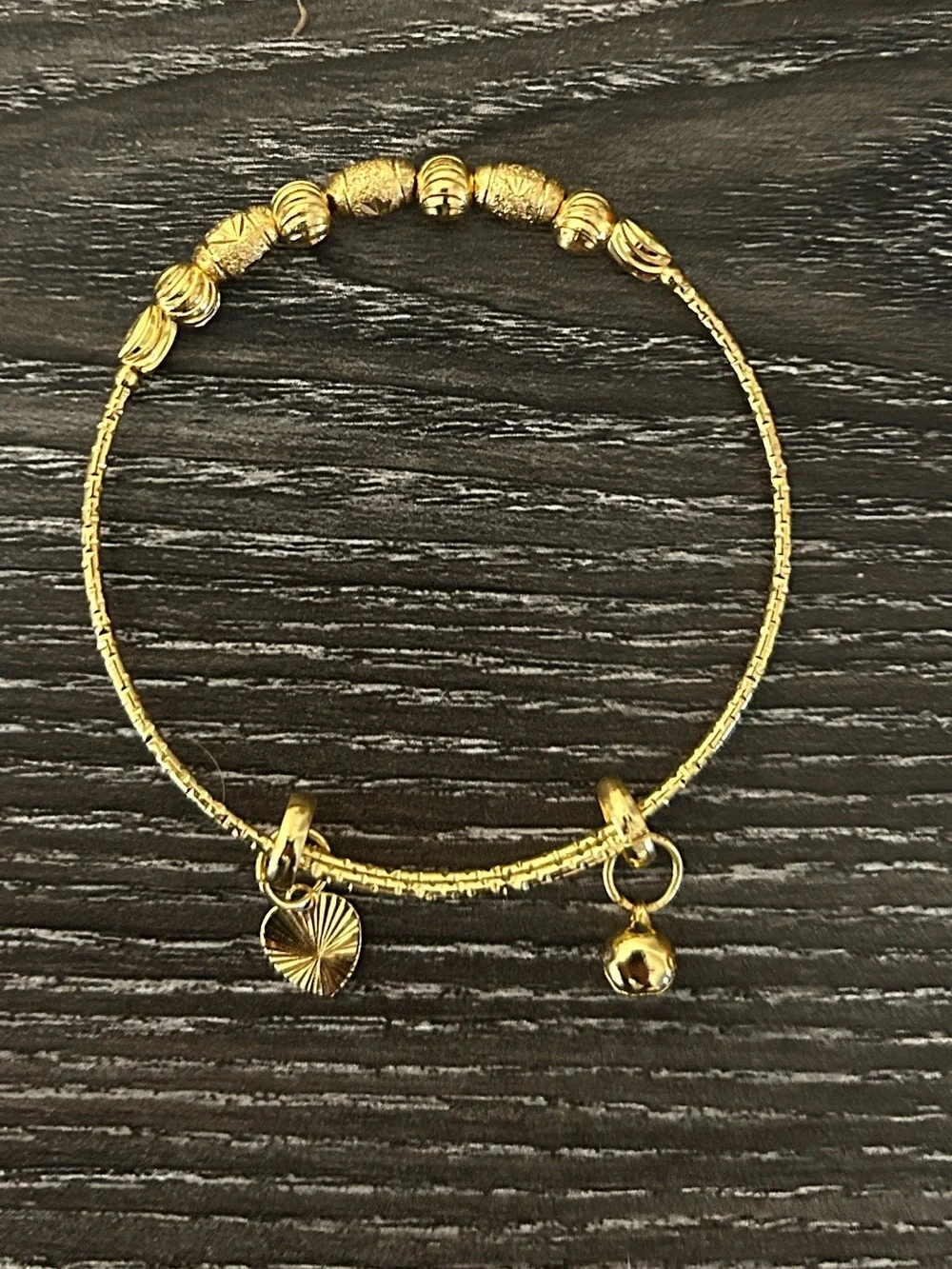 Golden tone beaded charm bracelet